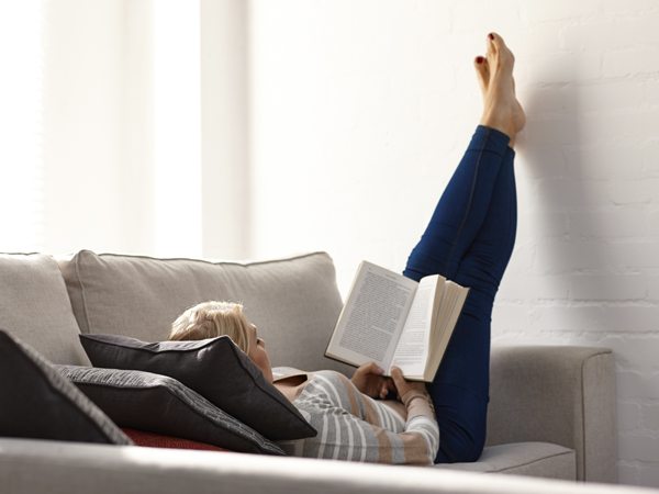 Woman reading on couch
