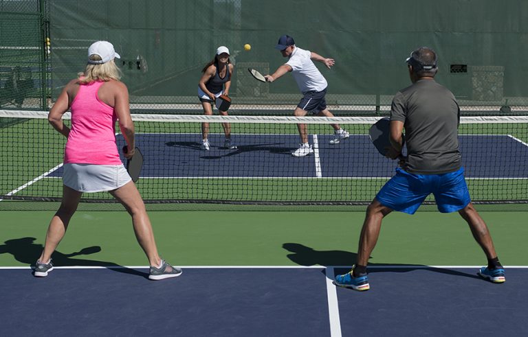 Four People Playing Pickleball